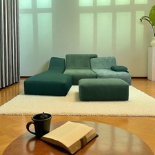 Green Confluences three seater sofa by Ligne Roset with footstool