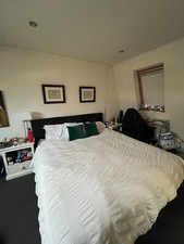 Black leather bed frame. Retail is £1000 but been used for some time 