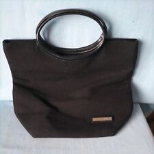Jane Norman Handbag. Black. Magnetic fastening, zip pocket. Fabric. 
