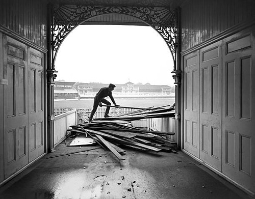 Demolition squads tear - , down