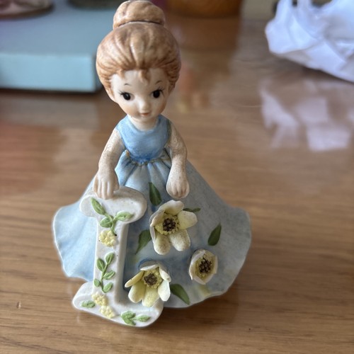 Little girl figurine with blue - little,