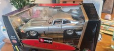 Collectible car in the original box. Jaguar "E" Coupe`1961 SC  Grey. Bburago. 