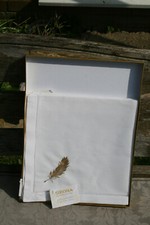 4 beautifully embroidered white cotton napkins