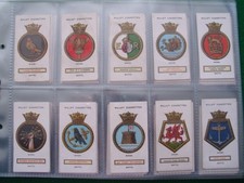 FULL SET OF 50 WILLS CIGARETTE CARDS "SHIPS BADGES" A SERIES IN PLASTIC SLEEVES