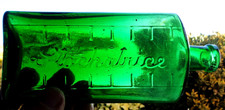 English Medicine Bottle in Vivid Emerald Green Glass with makers name.6 3/4 inch