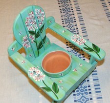 Hand painted small flower pot cactus pot succulent pot in a wooden chair 