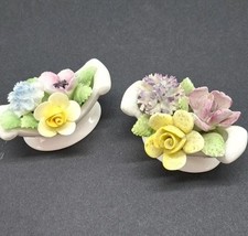 Vintage Royal Doulton rose posy bowls.  Pair 2 inches wide. Footed bowls.