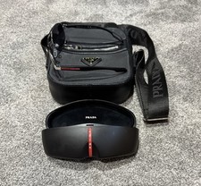 Prada Sunglasses & Prada Shoulder Bag.