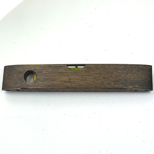 Wood and brass spirit - and, by