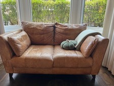 Tan leather two seater sofa