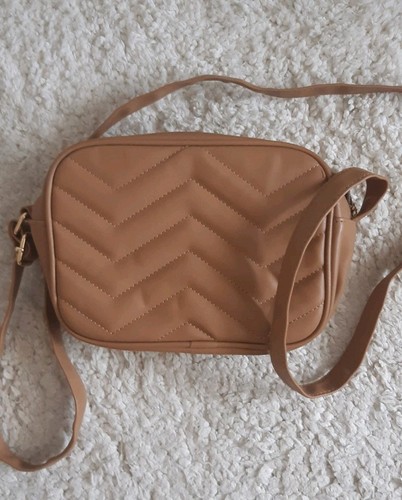 Light brown caramel cross - light,