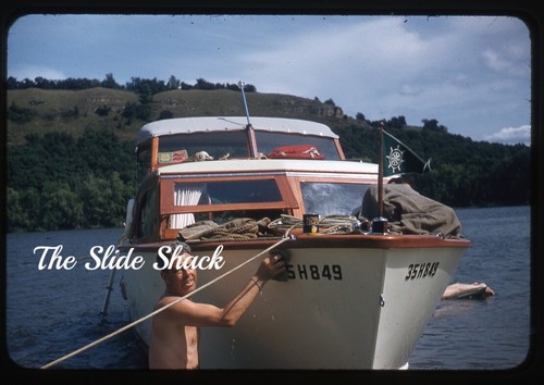 Man scrubbing chris craft - man,