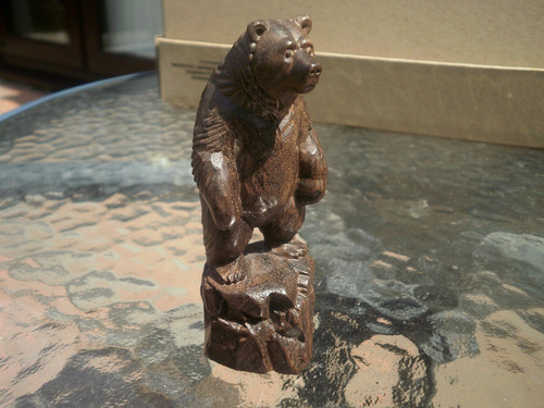 Carved wood bear - on, a