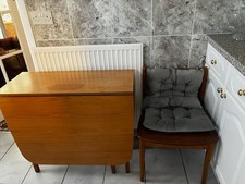 wooden folding dinning table and 2 chairs, folds to 1ft and extend to 6ft