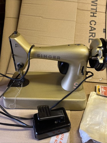 Gold colour singer sewing - singer,