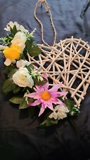 Beautiful wicker heart wreath with artificial  flowers white ,yellow and lilac 