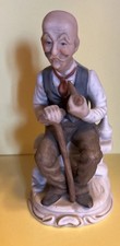 Ceramic Statue of Grandad Sitting Contemplating Life With Pipe And Stick