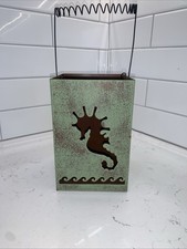 Metal Lantern Featuring A
