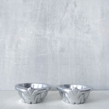 A pair of Carrol Boyes small