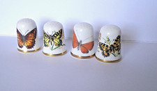 FOUR CAVERSWALL THIMBLES - BUTTERFLIES - TWO SIGNED C. NUNN AND TWO  M. GRANT