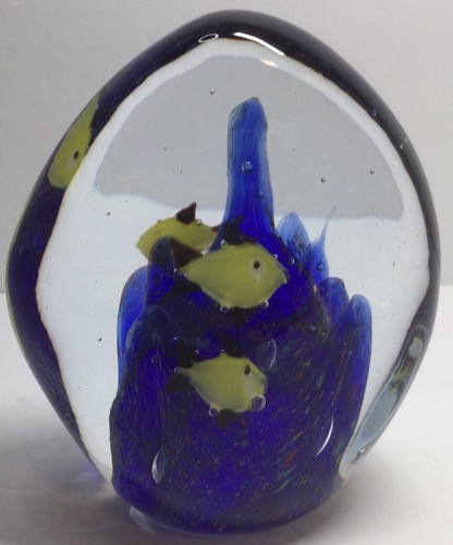 Glass egg paper weight with - paper,