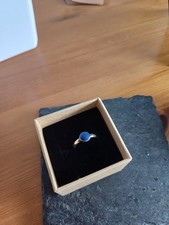 A Silver Ring With A Lapis Stone