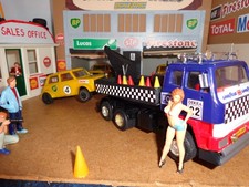 Scalextric 6 wheel recovery truck with hook and towing a Mini