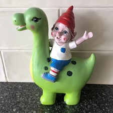 Garden Gnome Riding A Green