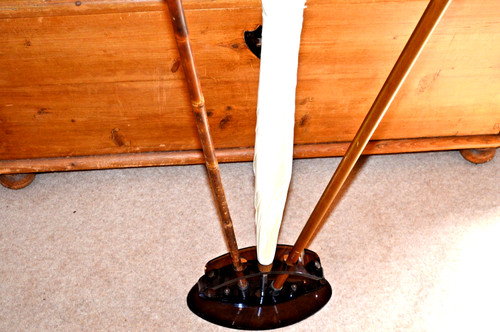 Umbrella and walking stick - and,