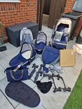 Blue egg twin pram with accessories