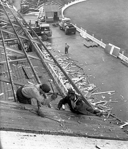 Demolition squads tear - , down