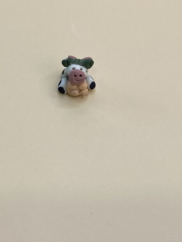 Collectible tiny cow clay mate - tiny,