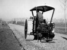 Worker on road roller Italy