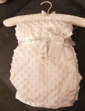 White popcorn velour style blanket with satin edge.