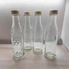 4 Vintage Embossed Soda Stream Bottles and Lids