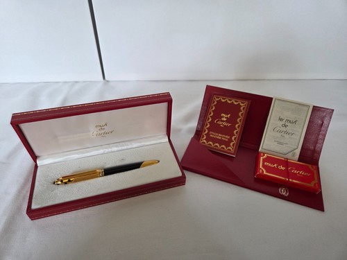 Cartier must de - must,