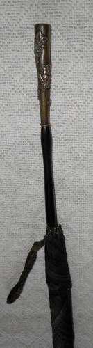 Antique black umbrella st - by,