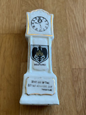 crested grandfather clock -