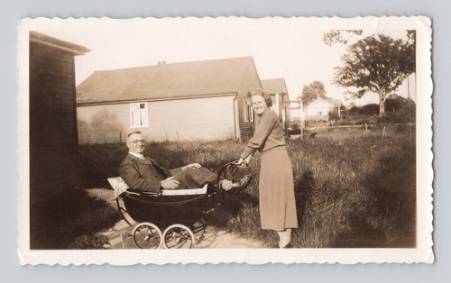 Old photo man sitting in - b&w,