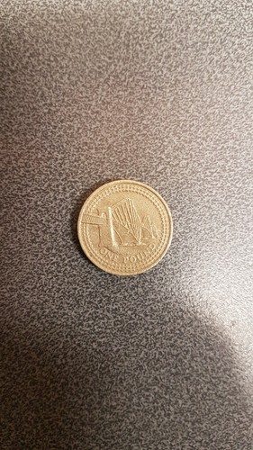 Old one pound coin forth - old,