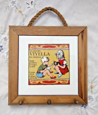 Viyella nursery for children fabric advert on a tile picture framed with hangers
