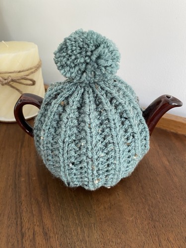 Hand knitted tea cosy for - hand,