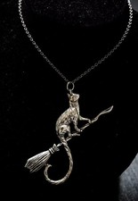 CAT ON A BROOMSTICK PENDANT