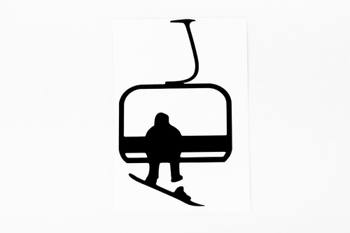 Snowboarder ski lift - on,