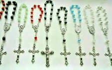 Single decade rosary beads with prayer card in clear plastic wallet.      