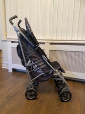 maclaren  push chair with a rain attachments