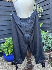 Royal Opera House black breeches cod piece velvet bows tassels Don P production 