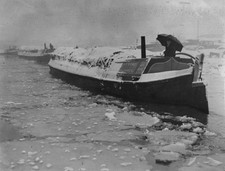 On Alperton canal barge owner using an umbrella to protect himself - Old Photo
