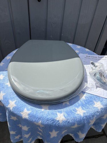 Dark grey toilet seat - toilet, brand