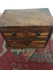 A Miniature Chest Of Drawers